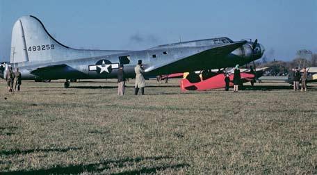 Brown B-1, now modified with a Continental C-85 and dubbed Suzie Jayne. This color photo, taken in late 1946 or early 1947, shows Buster near a U.S. Army Air Corps B-17.