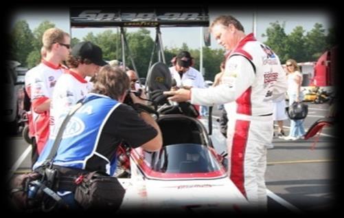 Special one-of-a-kind VIP pictures with Doug by the race car Four invitations to attend the