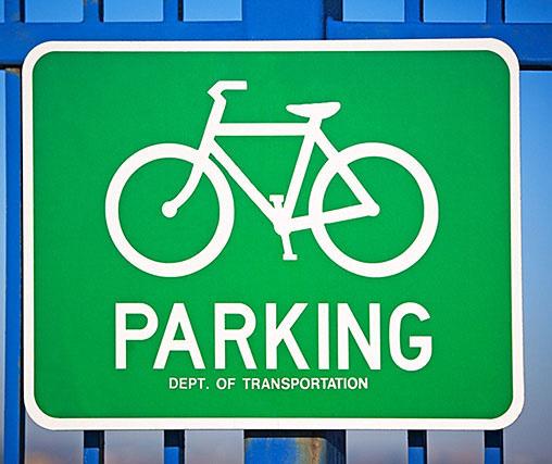 signs directing users to the location of short-term and long-term bicycle parking.