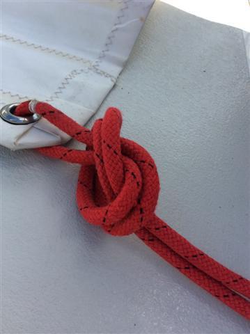 sheet through the foresail clew to the halfway mark and tie a knot.