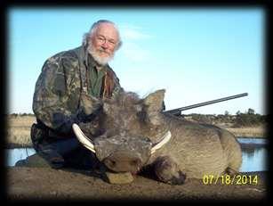 and he shot this BEAUTIFUL Warthog boar nearby a waterhole. Congratulations Paul!