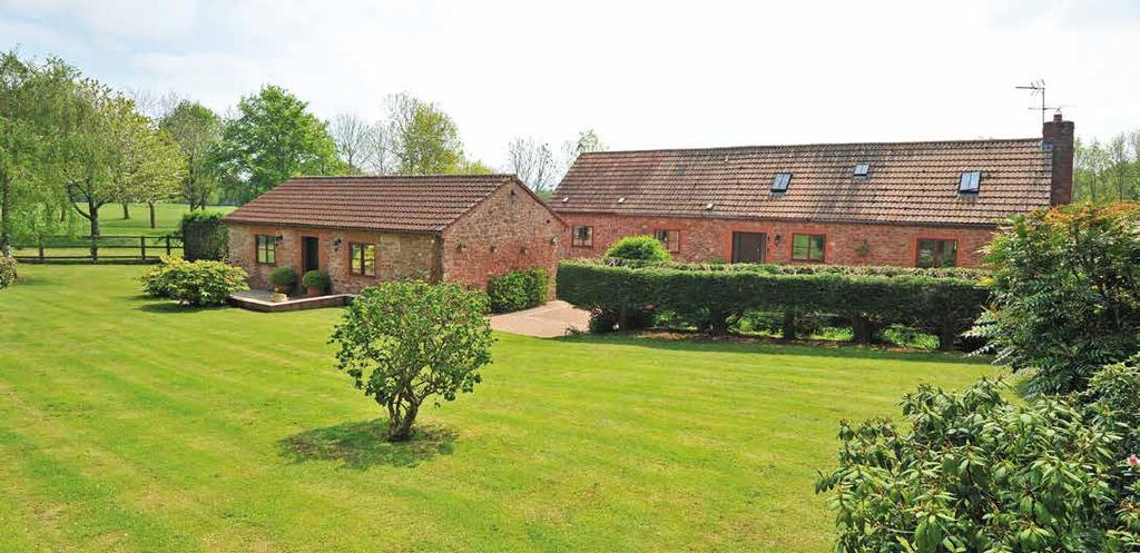 Outside Both Bakers Barn and the Annexe sit in the centre of 1.4 acres of very well maintained gardens and grounds.