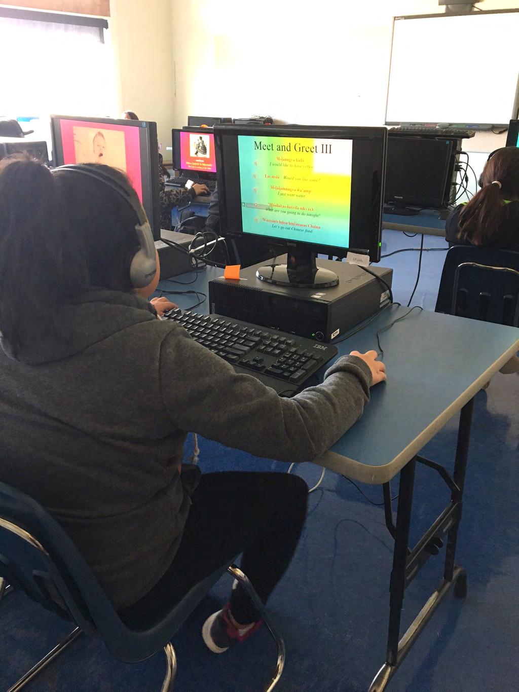 Once a week, grades 2-9 go to the BBCS computer lab during language class and work through PowerPoint presentations with images and embedded recordings, and repeat each word or phrase after hearing