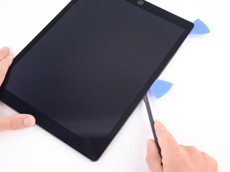 After letting the adhesive soften, insert the blade of your halberd spudger into the ipad above