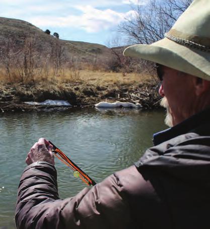 (Photo by Kelsey Dayton) Even though she was skeptical, the author managed to catch a brown trout on her first outing using the tenkara fishing style.
