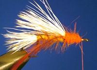Wrap the hackle backwards towards the tail of the fly.