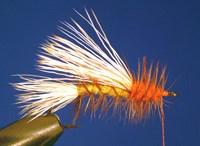 The copper wire will lock the hackle in place, and add durability to your fly. Tie the wire down, and trim the excess. Trim off the excess hackle.
