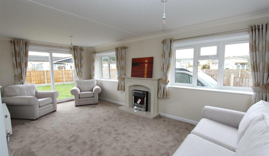 * Superb 19 ft Lounge * Separate Dining Room * Cream Fitted Kitchen with Integral Appliances * Utility Room * Master Bedroom with En Suite * Fitted Furniture to Both Bedrooms * Bathroom * Private