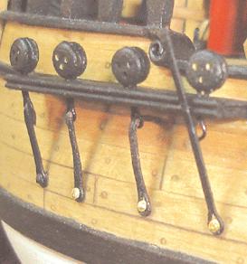 Normally a small thimble (bullseye) was seized to these eye bolts. A lanyard will be set up to secure the main and main top mast stays with these thimbles.