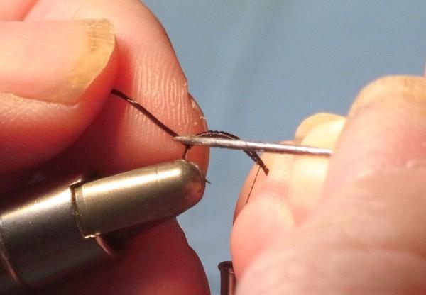 Take a sharp needle and split the tail portion of the Flexifloss into 3