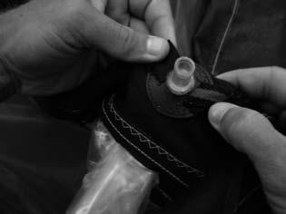 Re-tie your re-insertion string to the bladder and have your assistant pull the line to insert the bladder into the leading edge.