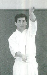 Shōtō hand pull to balance Left foot Fumikomi: Right hip forward w/ Daitō left hand & Shōtō hand pull to balance Fig 52d: ShōNitō,