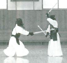 63a-1 at Tsubamoto by sliding motion of your hand downward from Jōdan position, and at the same time strike opponent s Men with your Shōtō as in Fig. 63a-3.