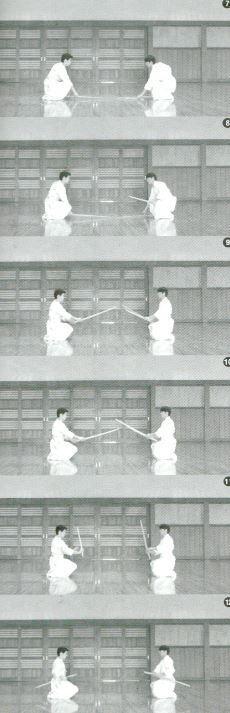 Hold Bokutō and take a stance in Sonkyo position as in [7-9]. Shidachi holds Daitō/Shōtō together as in [10], put them away in Hidai Waki (left hip) and stand up as in [11-13].