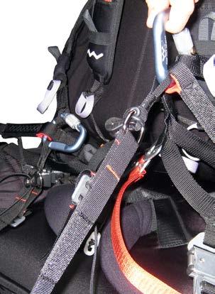 Then hook the loops on the upper straps to the main karabiners, ensuring that the pulleys and the