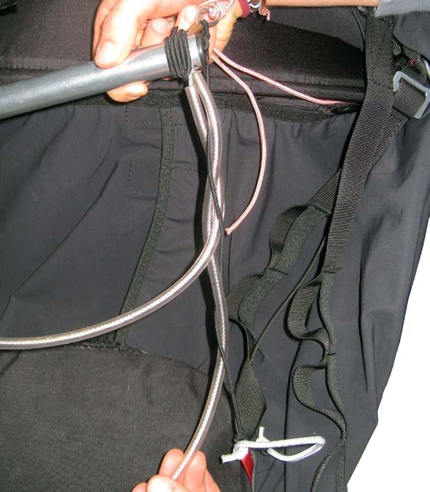 Twist the elastic cords previously tied to the base of the LEG COVER