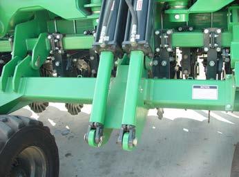If the unit is un-level use the end gaugewheel eyebolts to level the drill side to side.