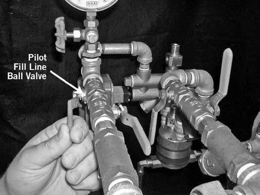 10. the ball valve on the pilot fill line to the OPEN FAST-FILL position. Charge the pilot line to 13 psi/90 kpa/0.9 Bar minimum.