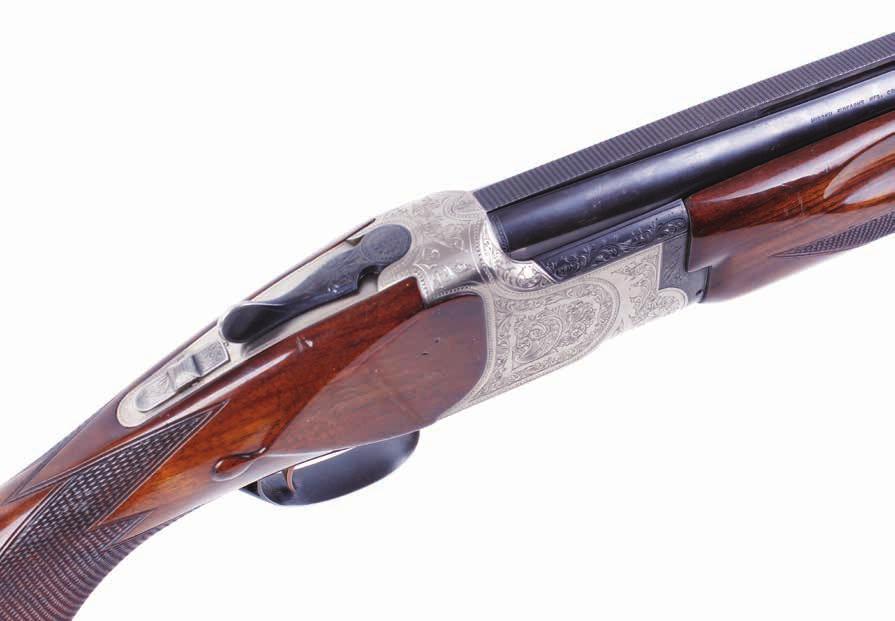 Lot 1180 S2 12 bore Miroku Charles Daly Diamond Grade 3 Trap over and under, ejector, 30 ins barrels, full & ¾, broad engine turned ventilated rib, 2¾ ins chambers, scroll and