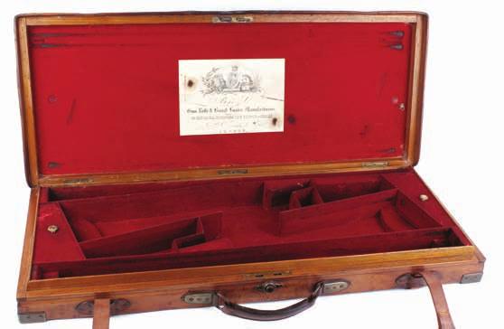 Lot 240 Large foam padded hard plastic shooters case; Gun Guard foam padded hard plastic rifle case (2) Est 20-40 Lot 241 Large gun room display cabinet, the red baize lined fully fitted interior