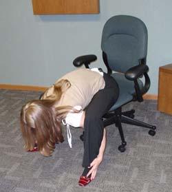 Back and Arm Stretch Slide to the front of your chair make sure your chair cannot roll backwards.