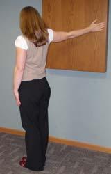 Shoulder and Chest Stretch Place your hand flat on the wall at shoulder height.