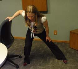 Push the leg towards the floor until you feel the stretch in your inner thigh and hip area. Hold. Repeat on other side.