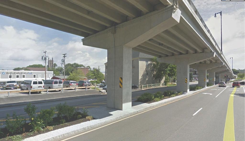 Install a barrier under the Route 1 Viaduct to prevent pedestrians from crossing Leeman Highway between