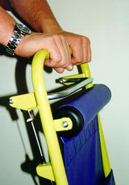 The Evacu-Trac brake is normally on. To descend the stairs, release the brake by slowly squeezing the brake lever.