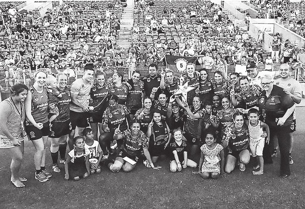 Indigenous All Stars, coached by Dean Widders, celebrate their victory over World in