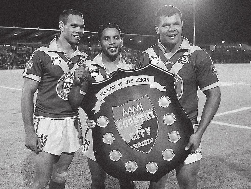 Amos Roberts, Preston Campbell and Dean Widders with the shield after Country s victory in the NSW City v Country Origin match in Dubbo, 12 May 2006 (Courtesy of the National Rugby League).
