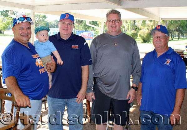 This set of past future and present Bronson Eagles is comprised of (from left) Jimmy Jones, Tate Barber Jones, Bronson High School Principal Tim McCarthy, Assistant Football Coach Micah Herron and