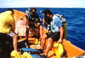 their skiff or workboat, SCUBA gear and air-filled lifting bags to bring the upper mooring line to the surface. The skiff was tied to the buoy system. Two divers with SCUBA gear (Fig.