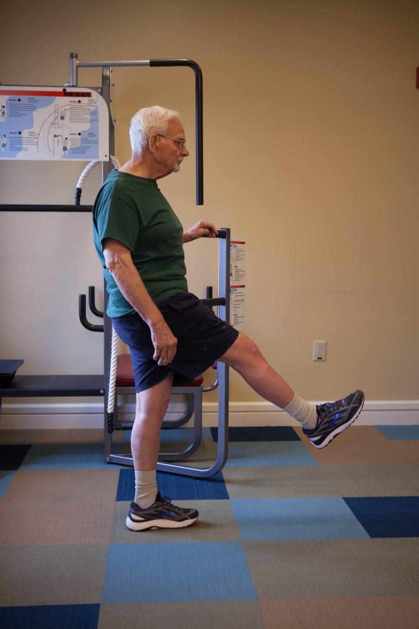 Hip Flexion Hip Extension Stand with feet together posture is tall: shoulders back and crown of the head reaching for the ceiling.