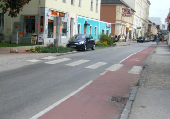 Bumps between bike lanes and pedestrian lanes should be sloped or we should make bumps between car lanes and bike lanes. Photo12.