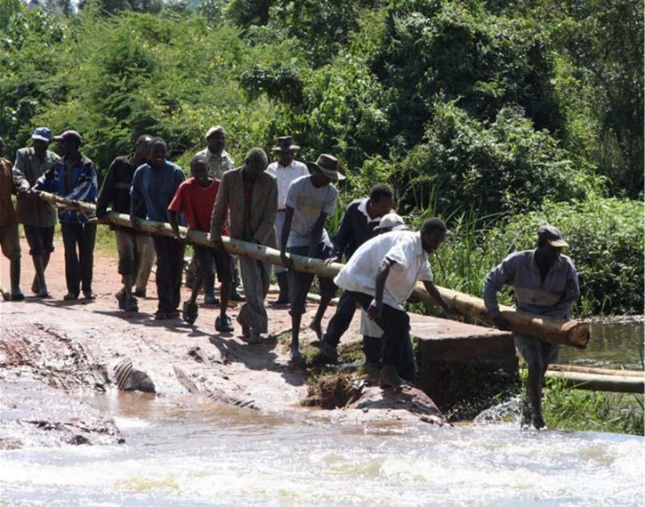 Making a Bridge The locals of Sinyereri came together in unison to make an alternate bridge after heavy rains destroyed the
