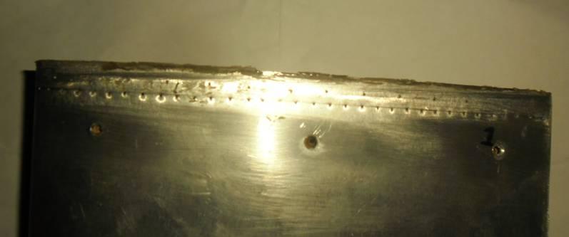 Holes Drilled for Pressure and Microphone sensors Holes for attaching metal skin of airfoil to support Fig. 2.