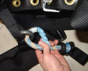 1) Separate the hook and loop fastener on the leg strap and disconnect the leg strap quick connect buckle.