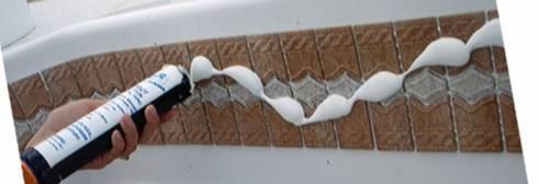 Use an epoxy grout float (hard rubber bottom) to push the grout into the grout joints.