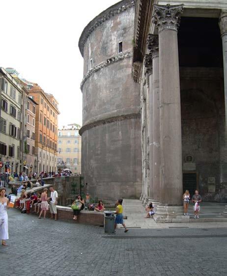 On their left, they see the ancient pillars and arches of Teatro Marcello.