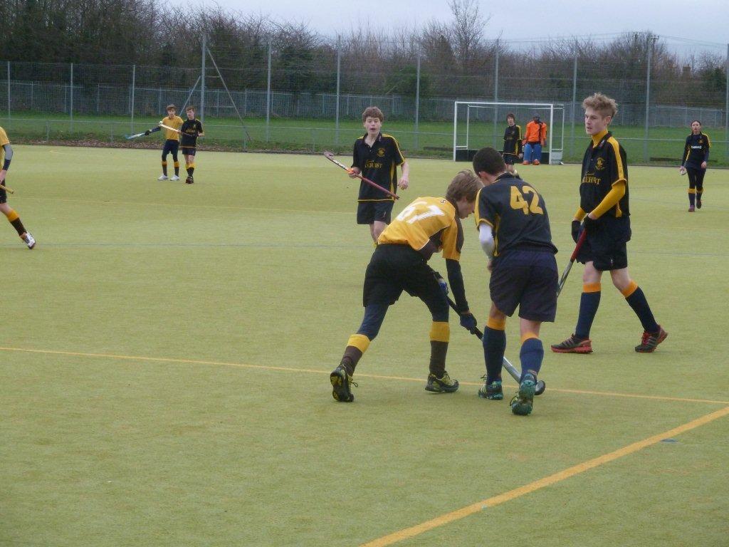 U16 Boys Will Griggs about to evade two Gore Court defenders. Note Max Streak in the top left: he has seen an area of space to run into and is signalling to Will where he wants the ball.