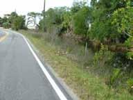 Location: East of Indian Creek Issue: Stone Structure Adjacent to Travel Lane There is a stone structure approximately six feet off the right edge of the travel lane on the
