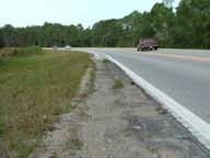 Pavement Edge Drop-offs A narrow shoulder pavement has been constructed on the inside of the two reverse curves; however, at the extremities of this shoulder pavement and also in the vicinity of the