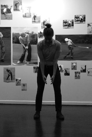 As student performs backswing portion of movement: Hands and arms draw back to about hip height as legs load slightly into ground?