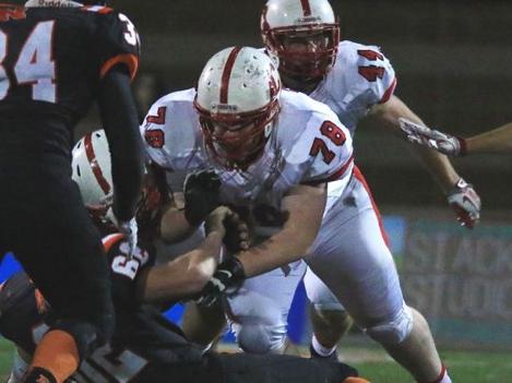 An example of Canton s work in the trenches. Junior offensive lineman David Gunnis (No. 78) puts a pancake block on a Northville player during last week s district final.