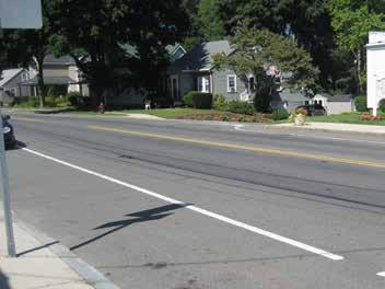 Install more mid-block street crossings with curb bump-outs to increase the points of friction on the roadway (see Observation 2 for proposed locations) Paint fog lines or parking stalls along the
