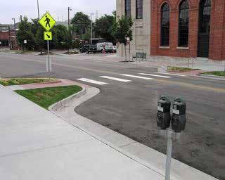 Wakefield has at least two pedestrian crossing signs in the downtown district north of our study area. Install curb bump-outs at mid-block crossings.