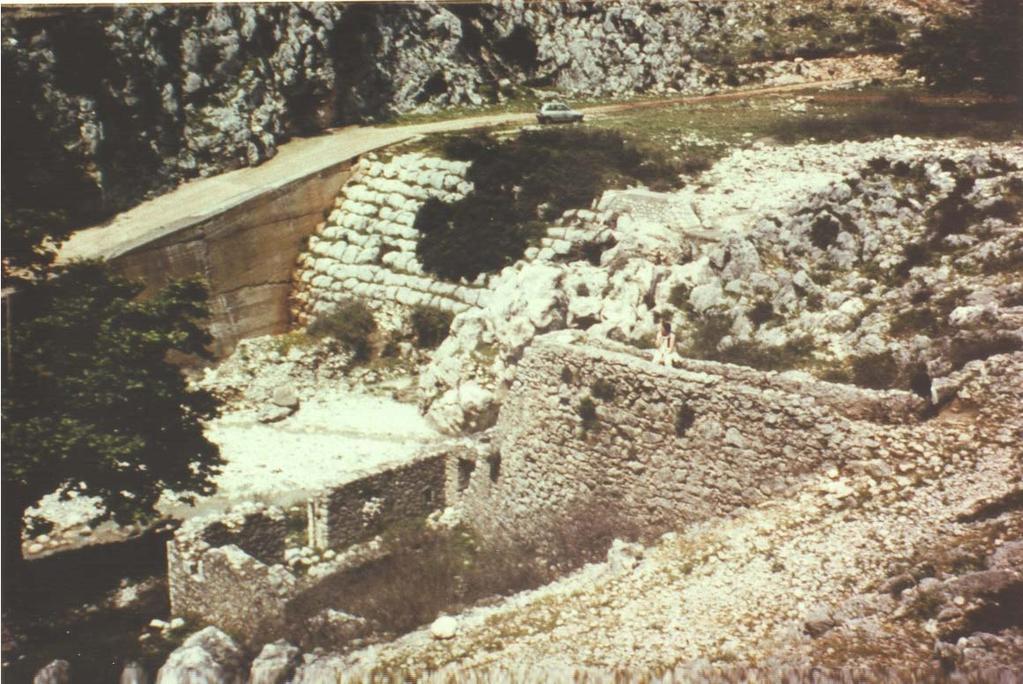 Fig. 1 - Old stepped weir in Akarnania, Greece B.C. 1,300 (Courtesy of Professor KNAUSS) Dam : 10.