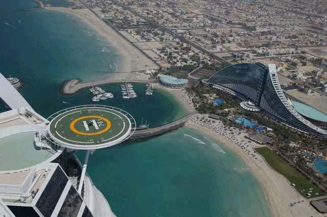 Pictures show Tiger practicing off the helicopter deck at the top area of the Burj Al Arab