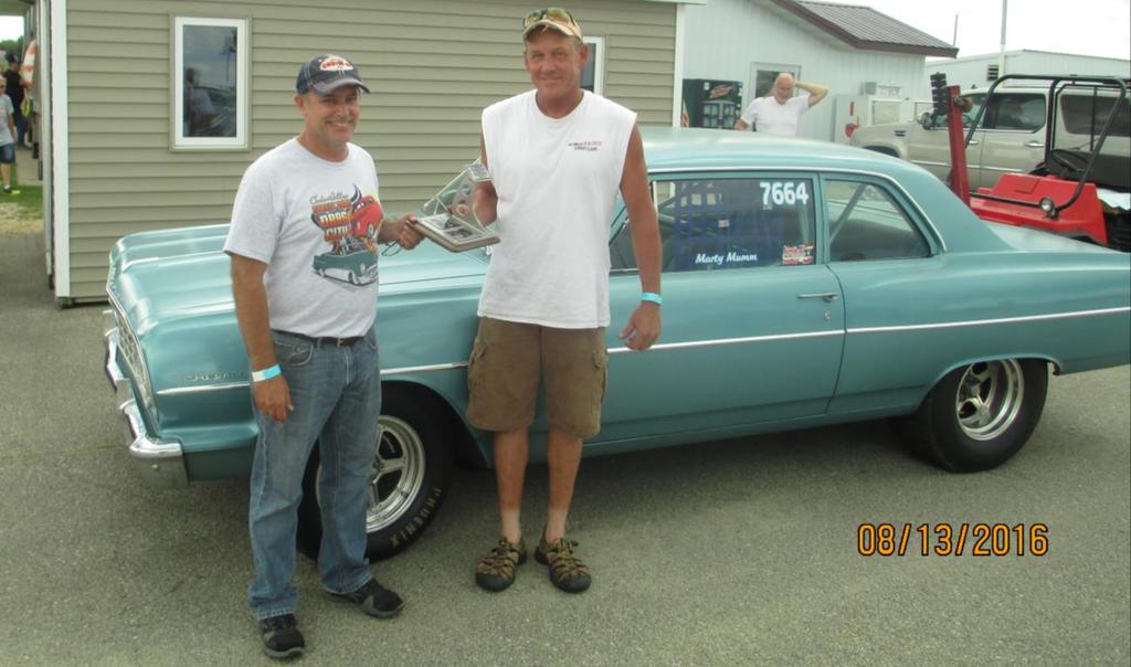 Entry # 74 Marty Mumm from Casville, WI with a 582 cu in powered Chevelle receiving the Leon Evens